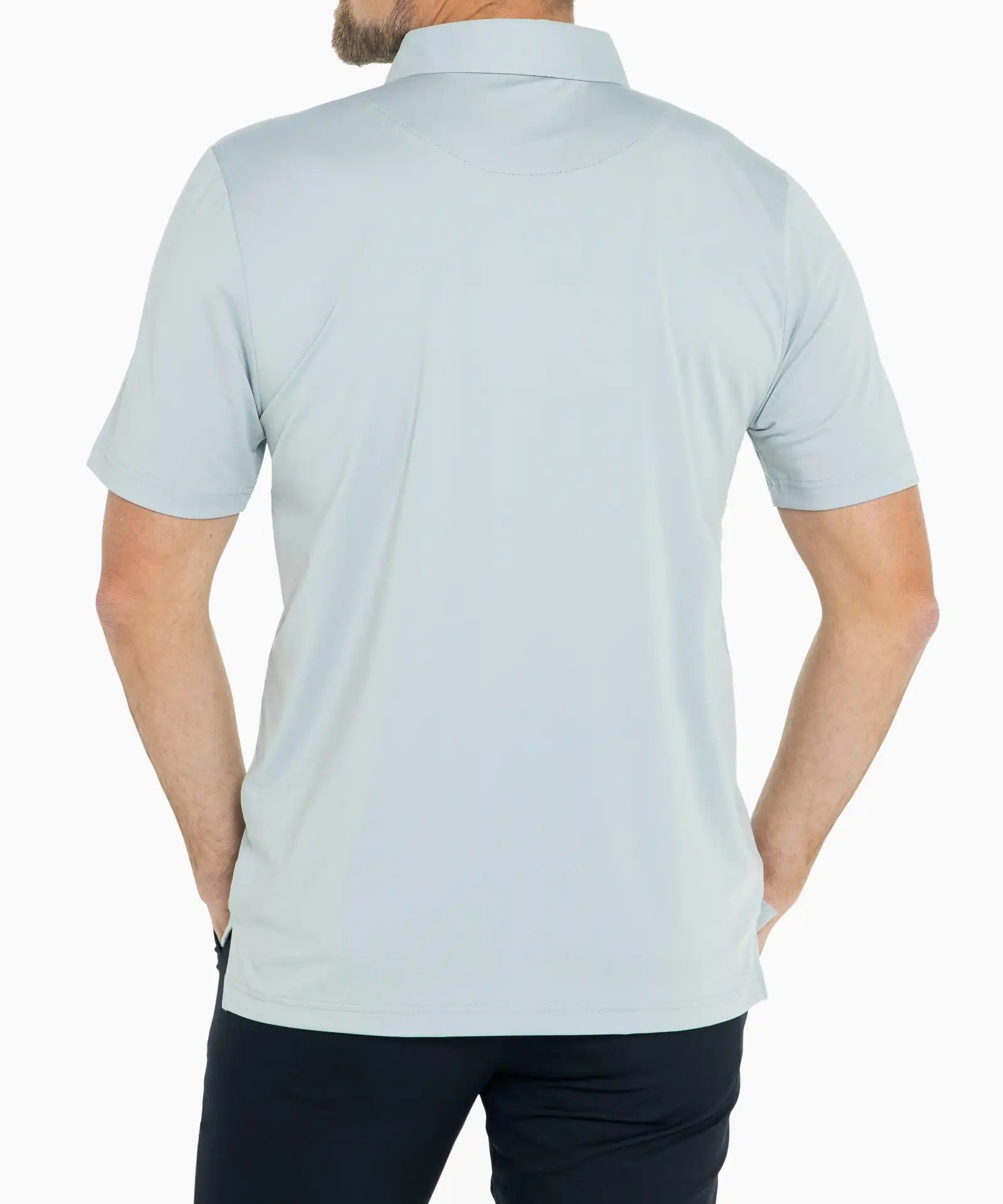 Man wearing a light blue polo shirt on a white background
