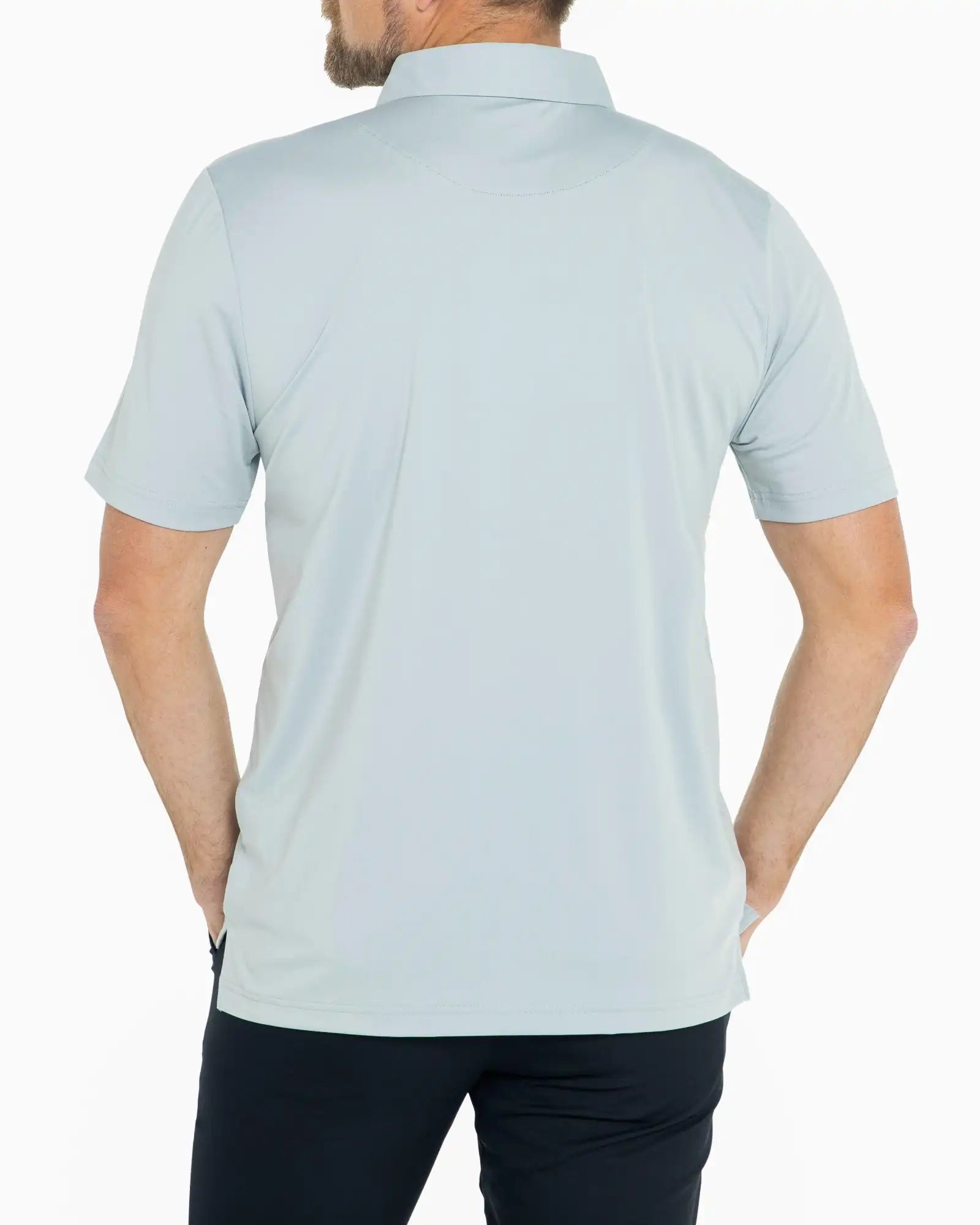 Man wearing a light blue polo shirt on a white background
