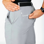Gray pants with a pocket being opened on a white background