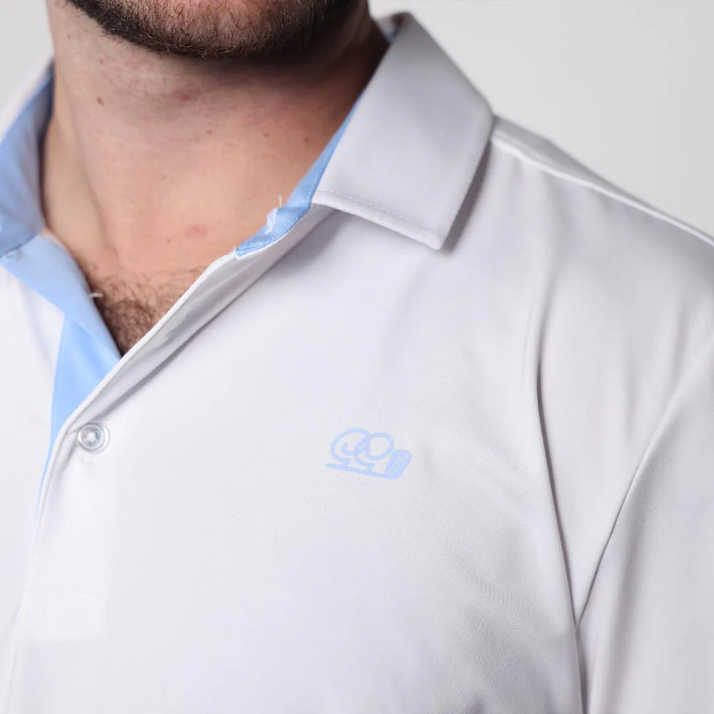 Close-up of a light gray polo shirt with a blue collar and logo on a plain background