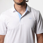 Man wearing a light gray polo shirt with a collar, brand logo visible.